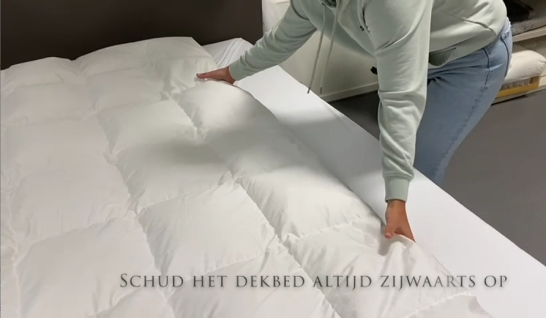 Fluffing a down duvet